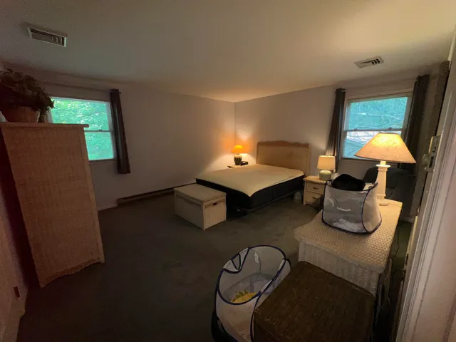 a bed room with a bed and dresser