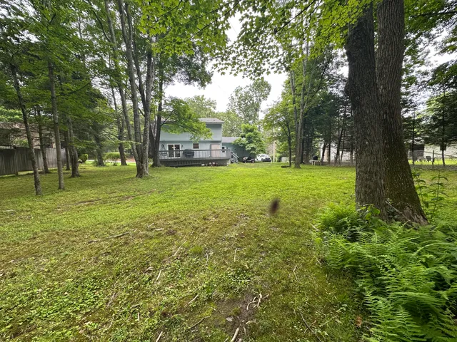 a view of house with a street