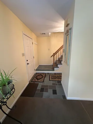 a view of entryway with wooden floor