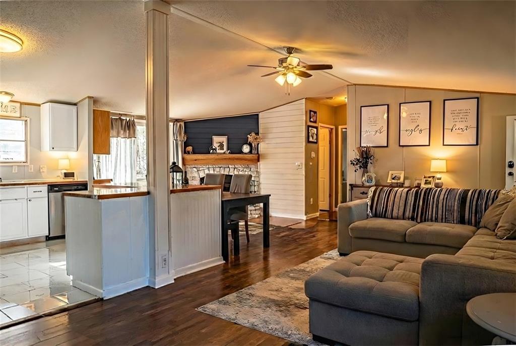 7328 Freeman Road Dawsonville, GA 30534 - Photo 4 of 11 a living room with stainless steel appliances furniture and a kitchen view