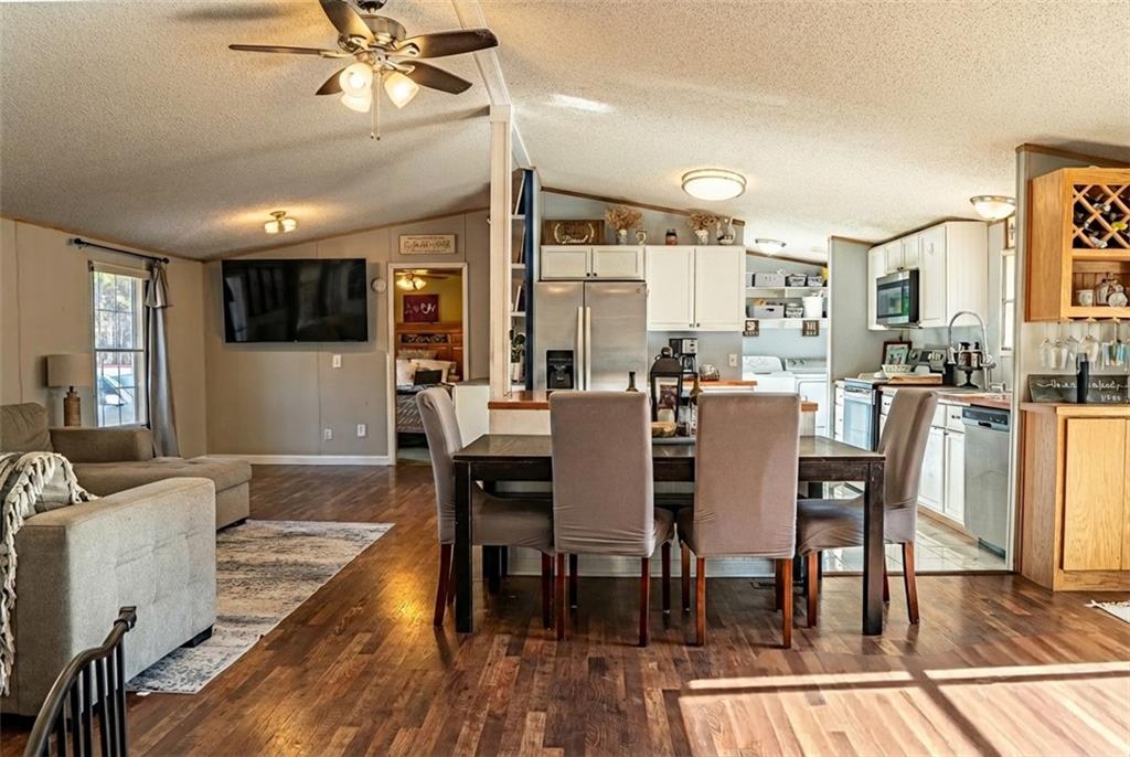 7328 Freeman Road Dawsonville, GA 30534 - Photo 6 of 11 a view of a dining room with furniture window and wooden floor