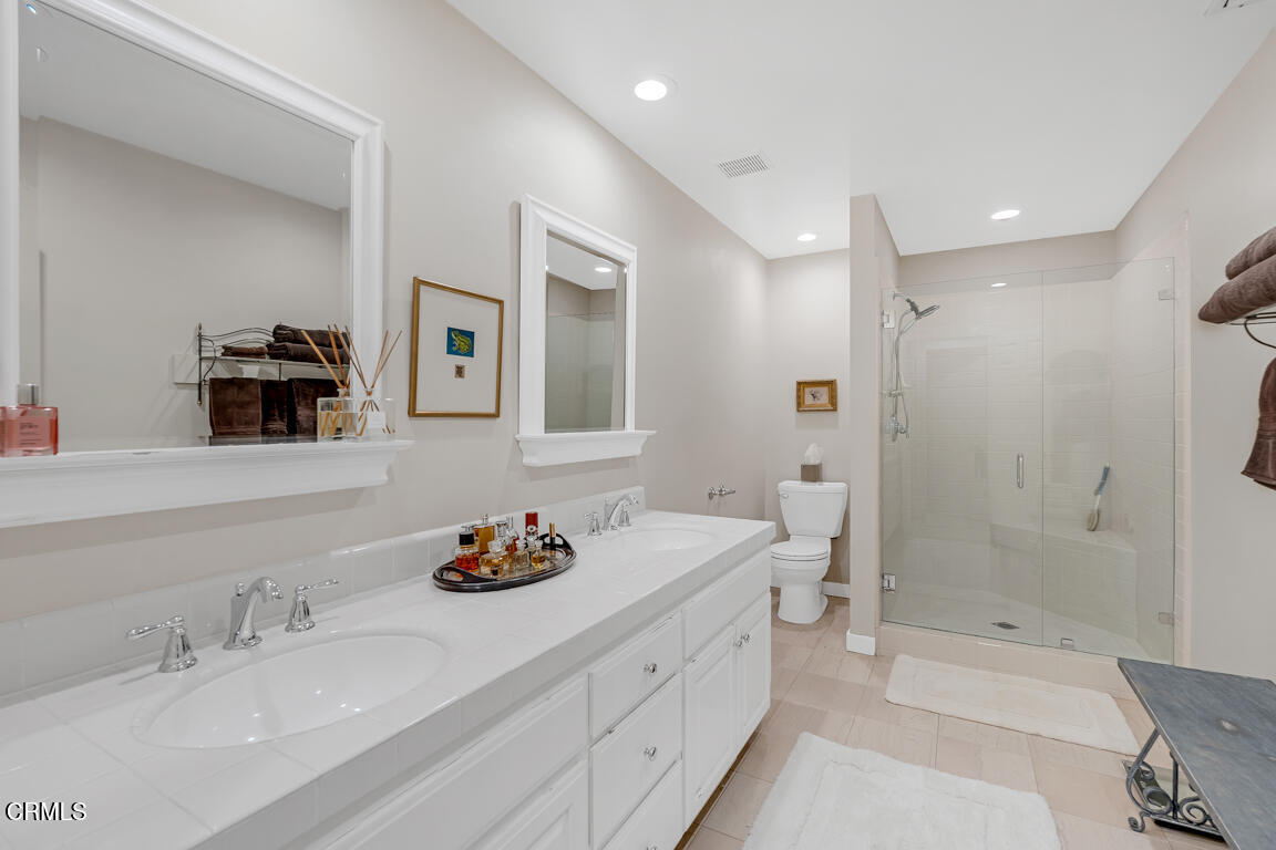 1333 Lida Street Pasadena, CA 91103 - Photo 21 of 38 a bathroom with a granite countertop sink mirror and bathtub