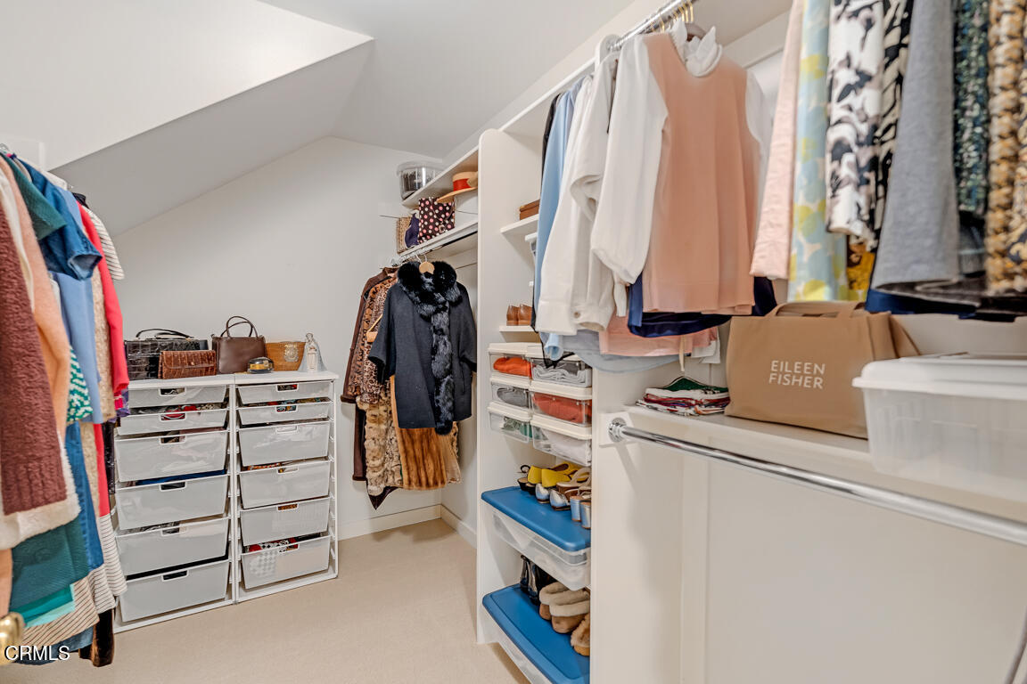 1333 Lida Street Pasadena, CA 91103 - Photo 22 of 38 a view of walk in closet with clothes and shoes