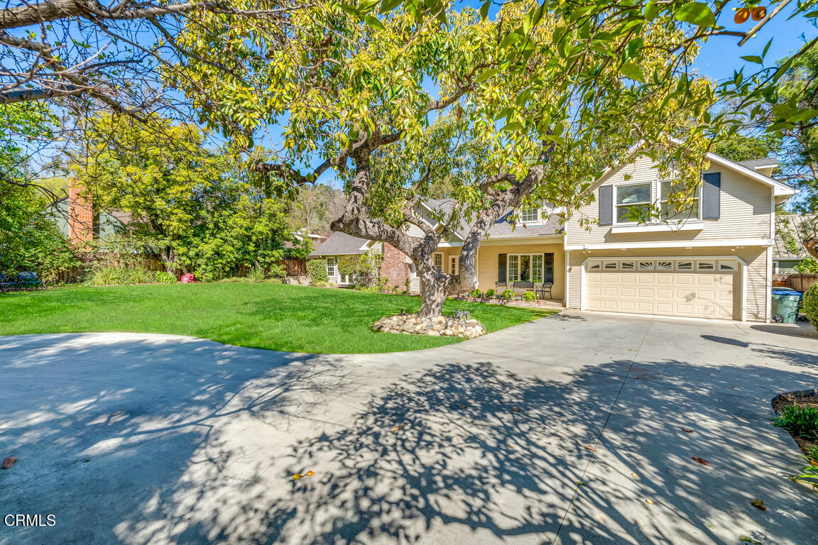 1333 Lida Street Pasadena, CA 91103 - Photo 31 of 38 a front view of a house with a garden and yard