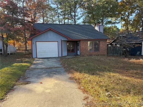 a house with yard in front of it