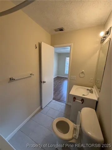 a bathroom with a toilet and a sink