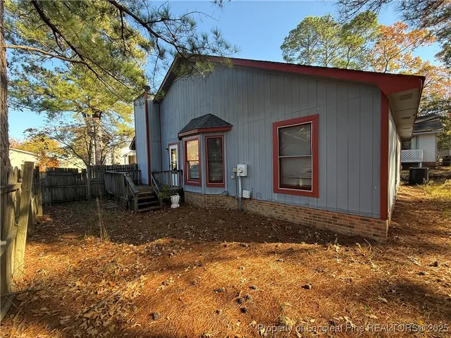 a house with trees in the background
