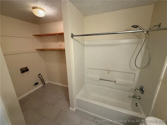 a bathroom with a shower and a tub
