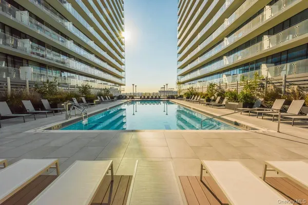 a view of a swimming pool with a patio