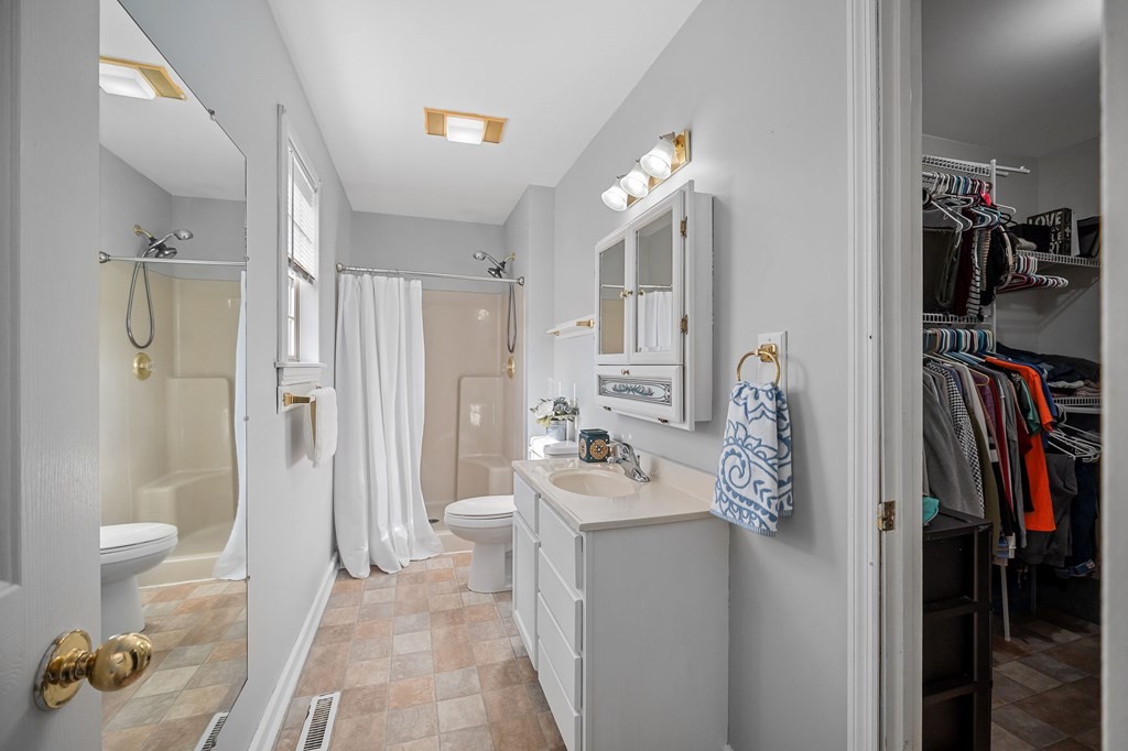 1656 Parker Road Sparta, TN 38583 - Photo 27 of 32 a bathroom with a sink mirror and shower