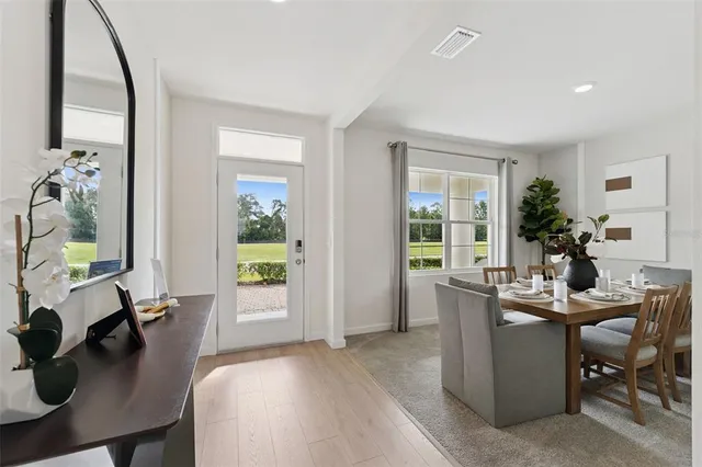 a view of a dining room with furniture window and outside view