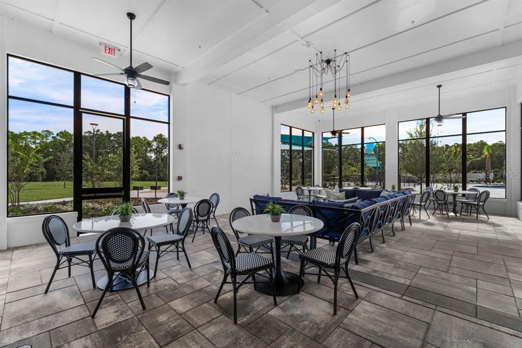 2857 House Finch Road St. Cloud, FL 34773 - Photo 42 of 70 a view of a dining room with furniture window and outside view