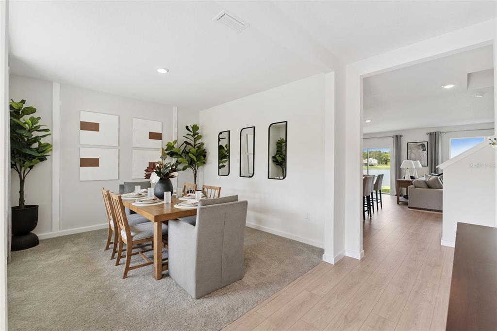 2857 House Finch Road St. Cloud, FL 34773 - Photo 5 of 70 a view of a dining room with furniture and wooden floor