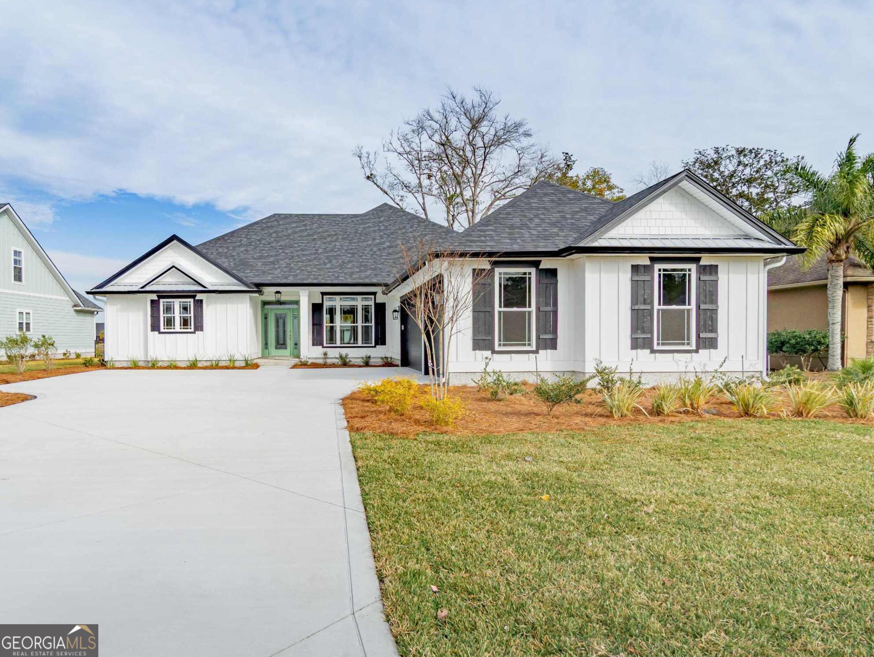 201 Riley Hunter Drive Kingsland, GA 31548 - Photo 1 of 79 a front view of a house with a garden