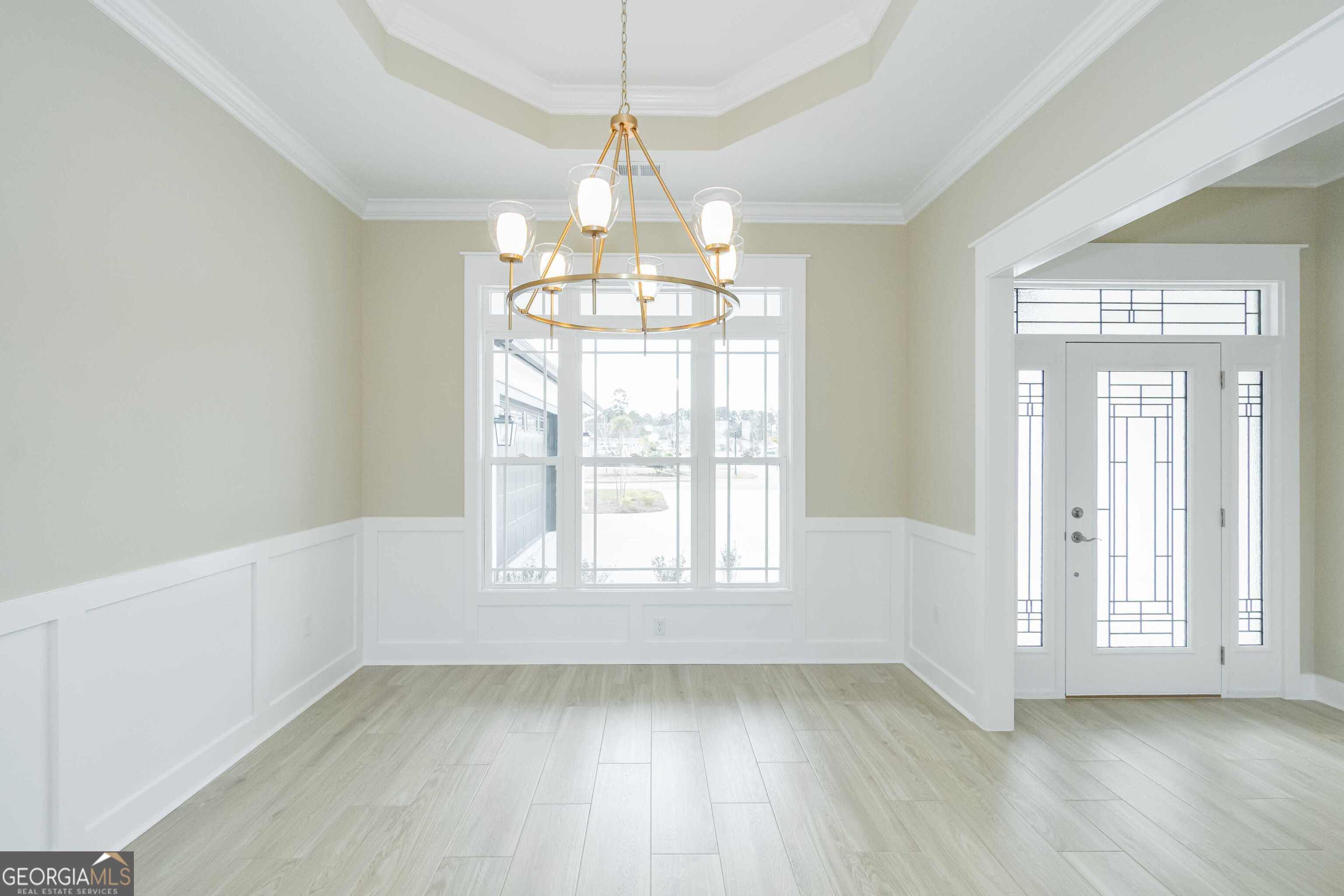201 Riley Hunter Drive Kingsland, GA 31548 - Photo 13 of 79 a view of an empty room with wooden floor and a window
