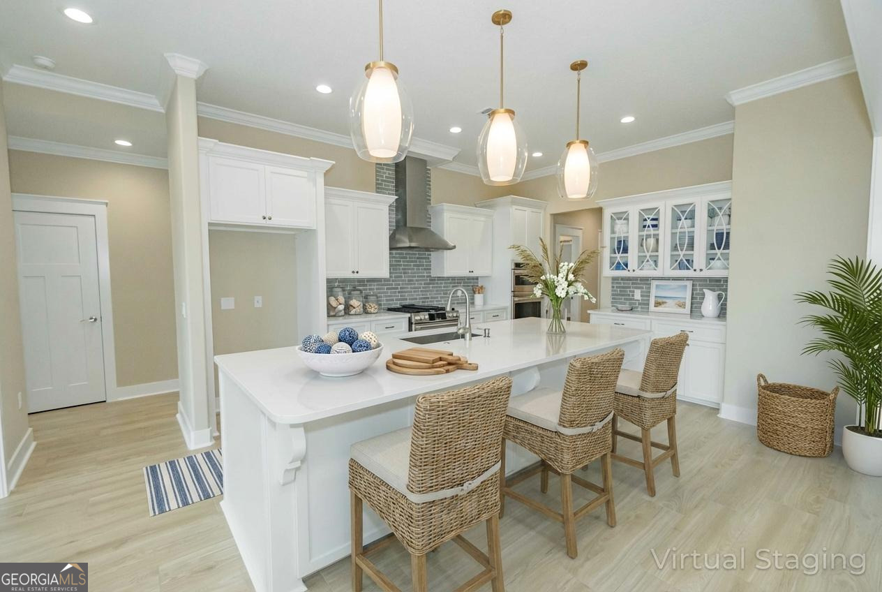 201 Riley Hunter Drive Kingsland, GA 31548 - Photo 23 of 79 a kitchen with a dining table chairs sink and stove