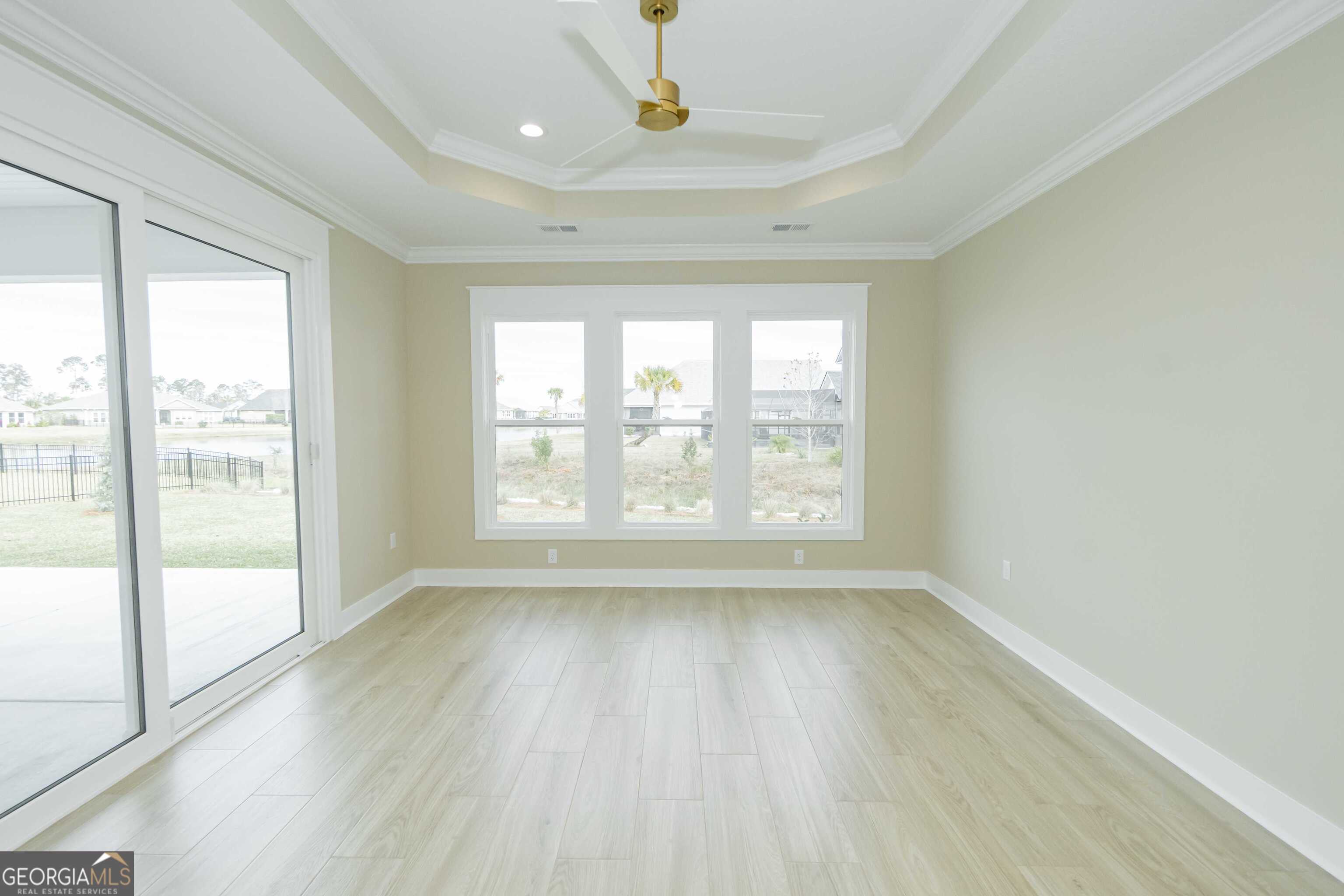 201 Riley Hunter Drive Kingsland, GA 31548 - Photo 30 of 79 a view of empty room with wooden floor and fan