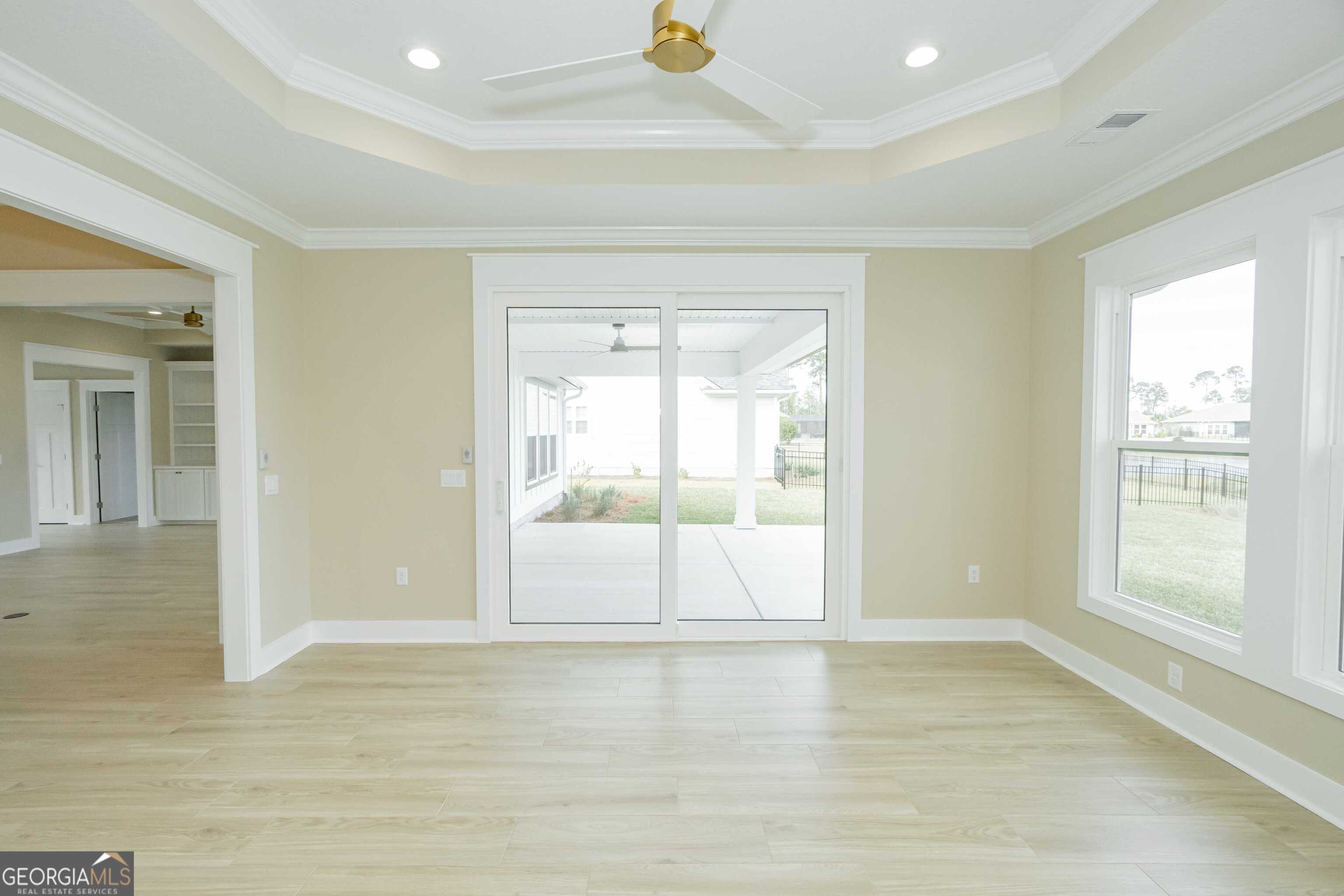 201 Riley Hunter Drive Kingsland, GA 31548 - Photo 31 of 79 an empty room with wooden floor and windows