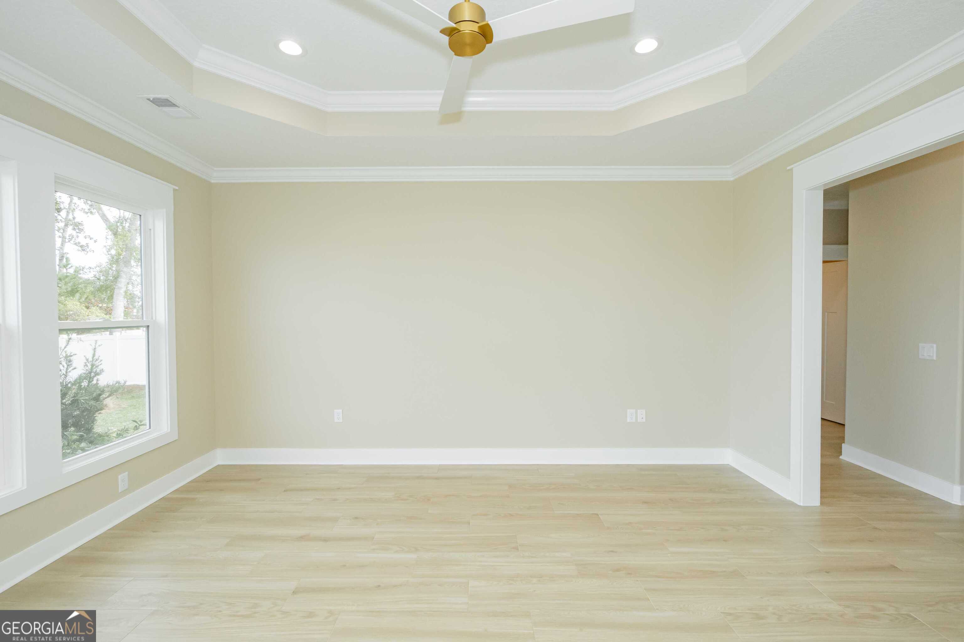 201 Riley Hunter Drive Kingsland, GA 31548 - Photo 33 of 79 a view of an empty room with wooden floor and a window