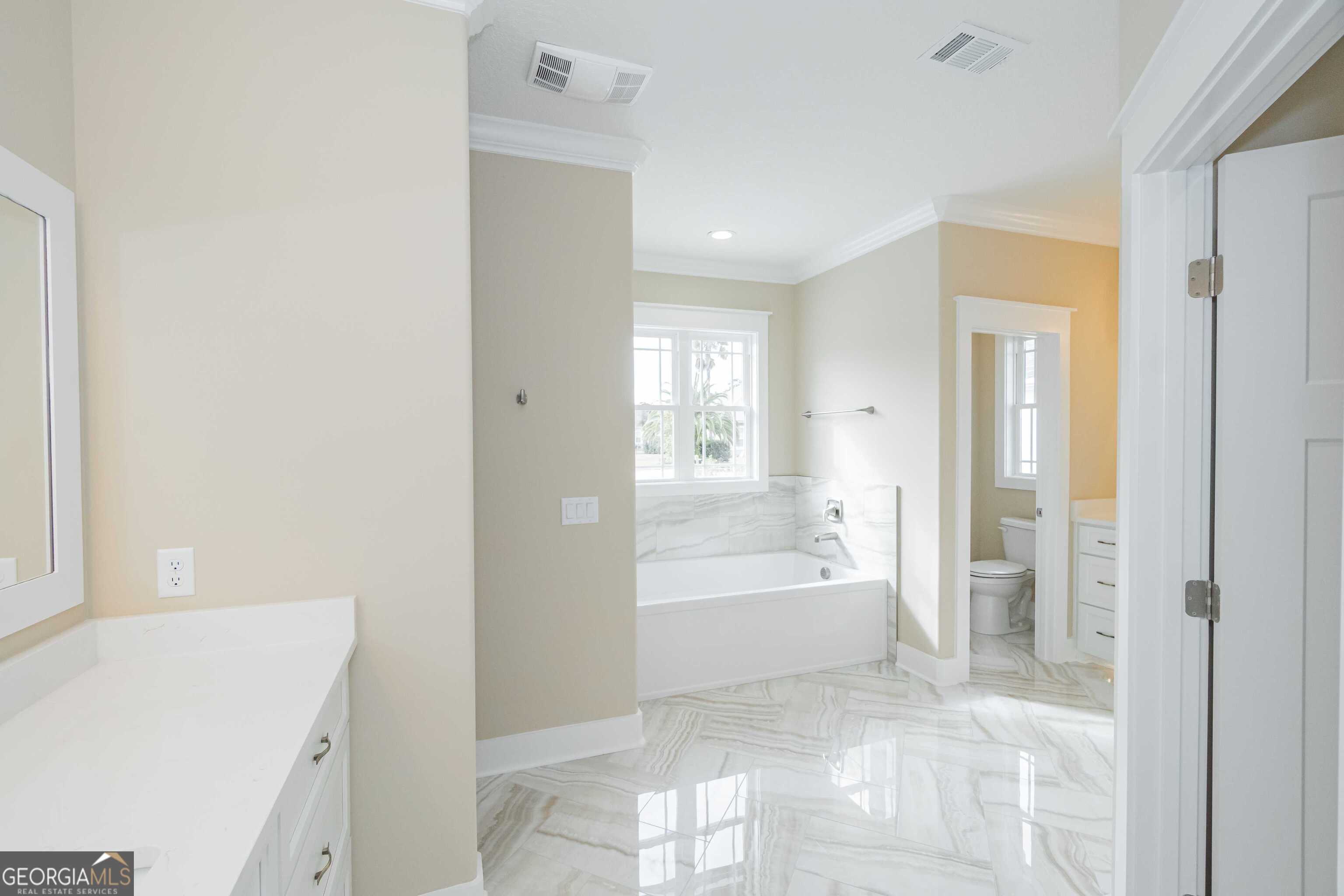 201 Riley Hunter Drive Kingsland, GA 31548 - Photo 39 of 79 a bathroom with a bathtub and a sink