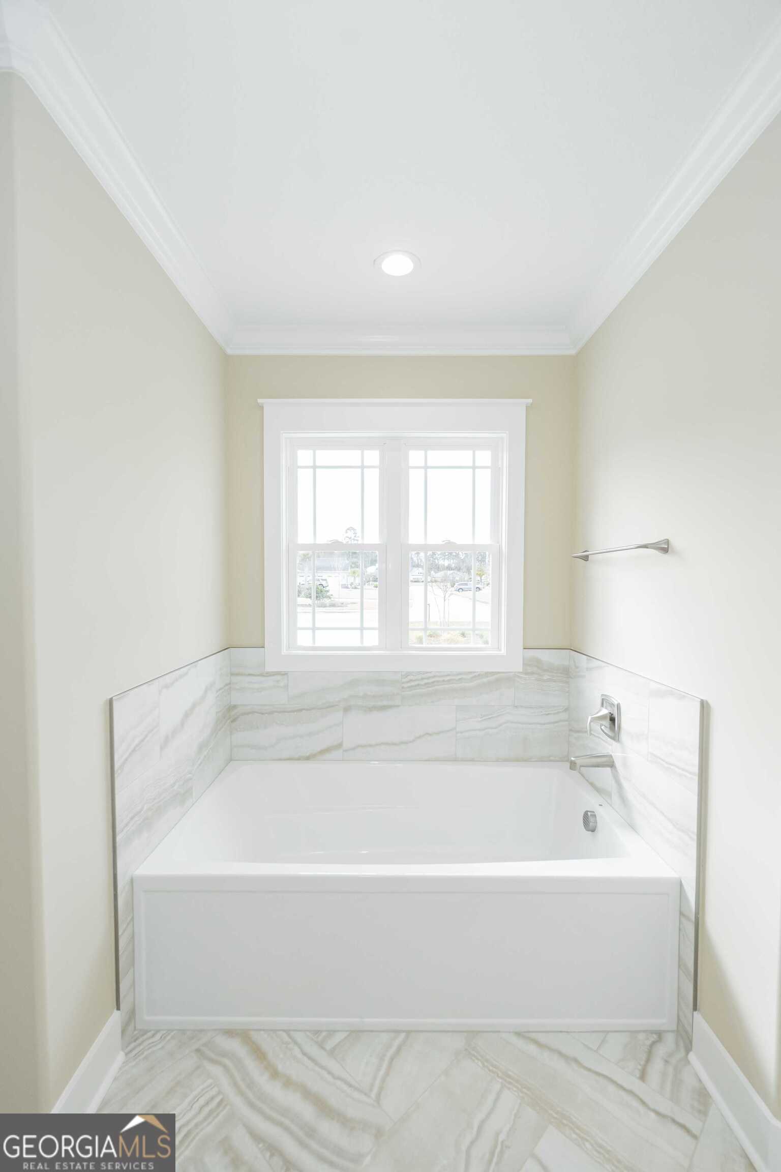 201 Riley Hunter Drive Kingsland, GA 31548 - Photo 44 of 79 a white bath tub sitting in a spacious bathroom next to a window