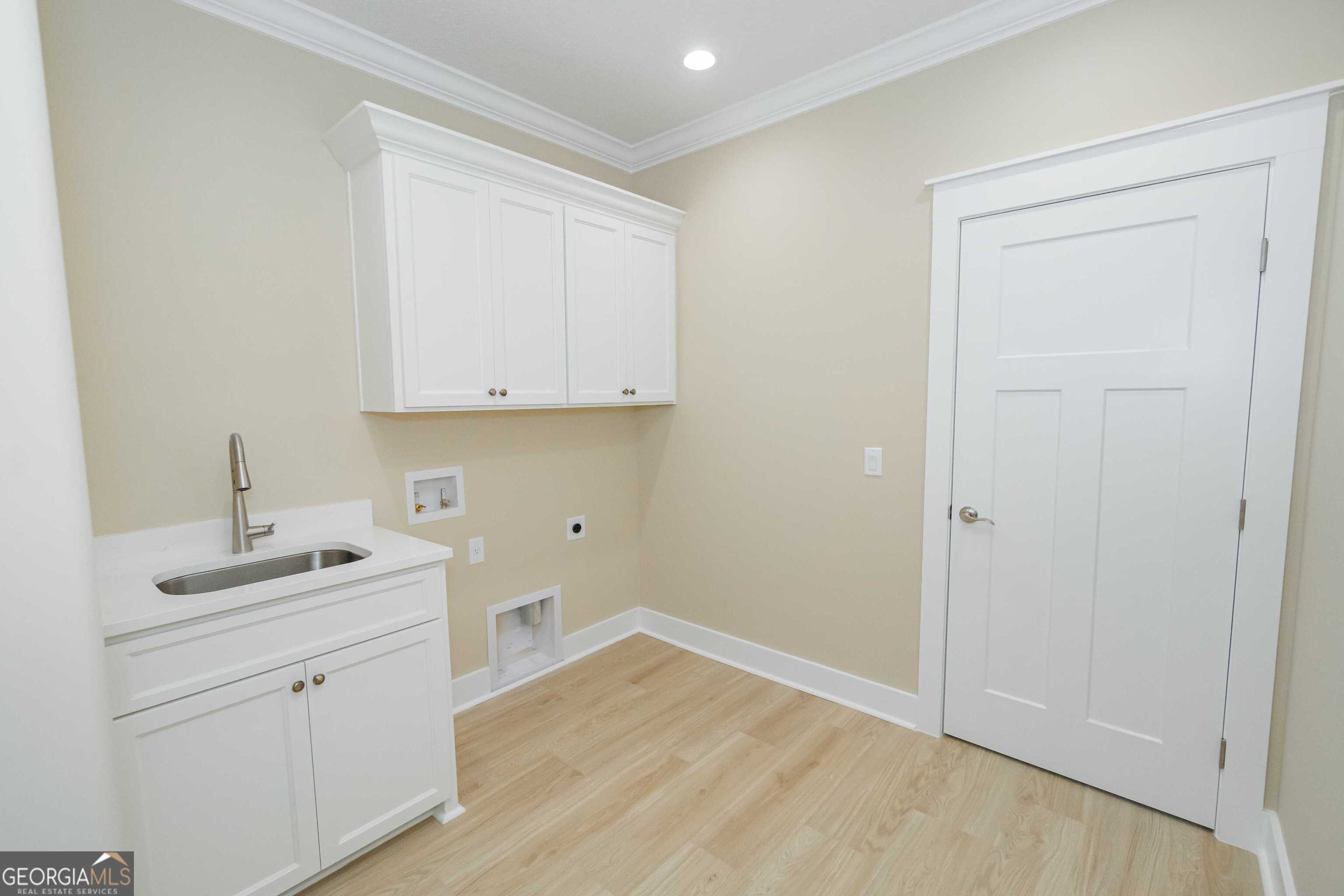 201 Riley Hunter Drive Kingsland, GA 31548 - Photo 74 of 79 a view of cabinets a sink and dishwasher in a room