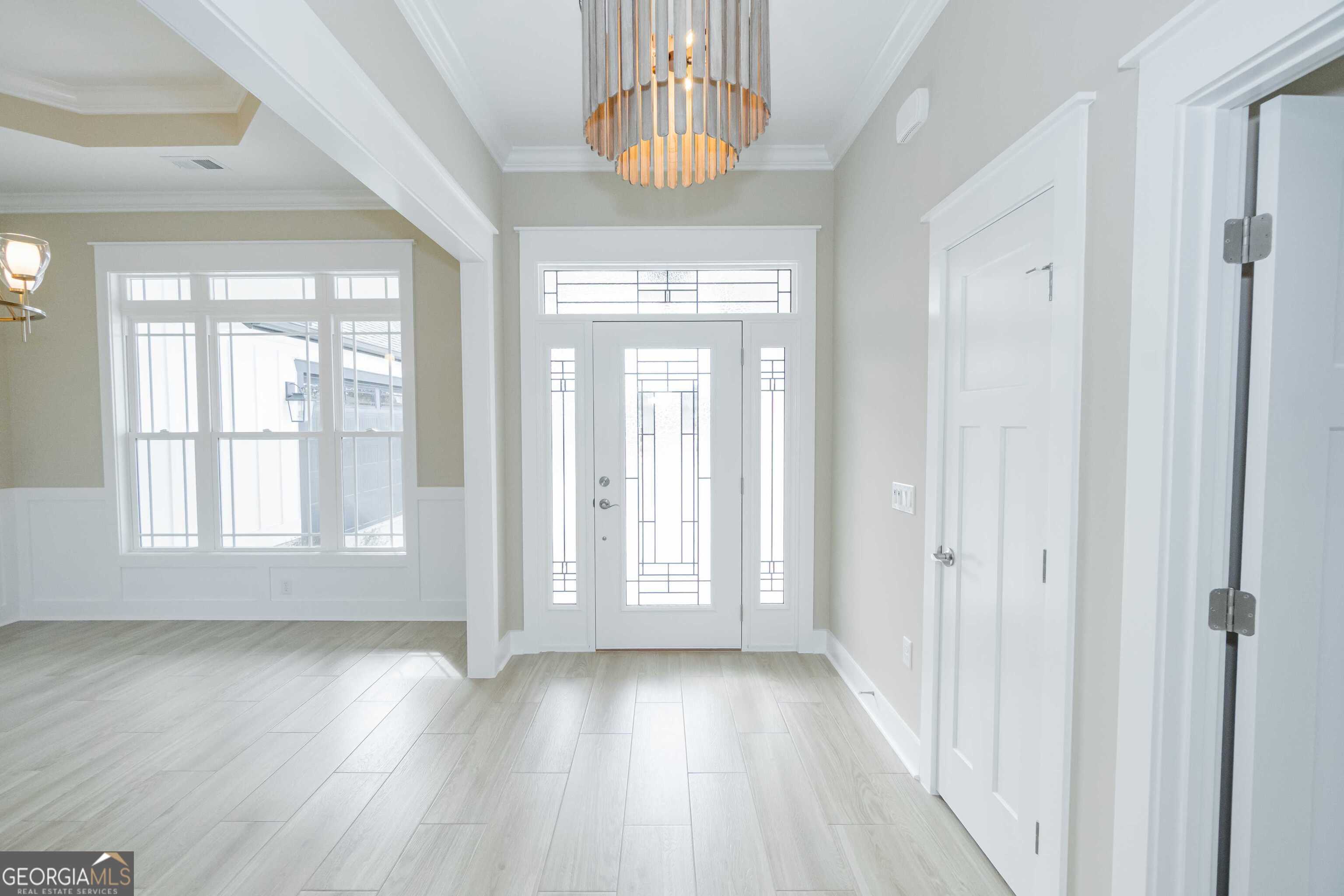 201 Riley Hunter Drive Kingsland, GA 31548 - Photo 8 of 79 a view of an entryway with wooden floor