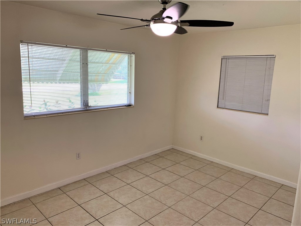 301 East Penn Road Lehigh Acres, FL 33936 - Photo 12 of 25 a view of empty room with windows