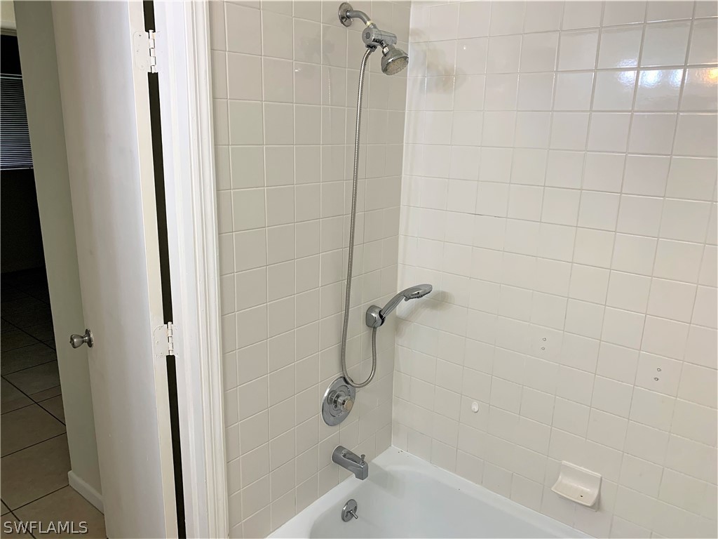 301 East Penn Road Lehigh Acres, FL 33936 - Photo 15 of 25 a bathroom with a bathtub