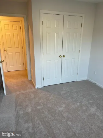 a view of an empty room and a window