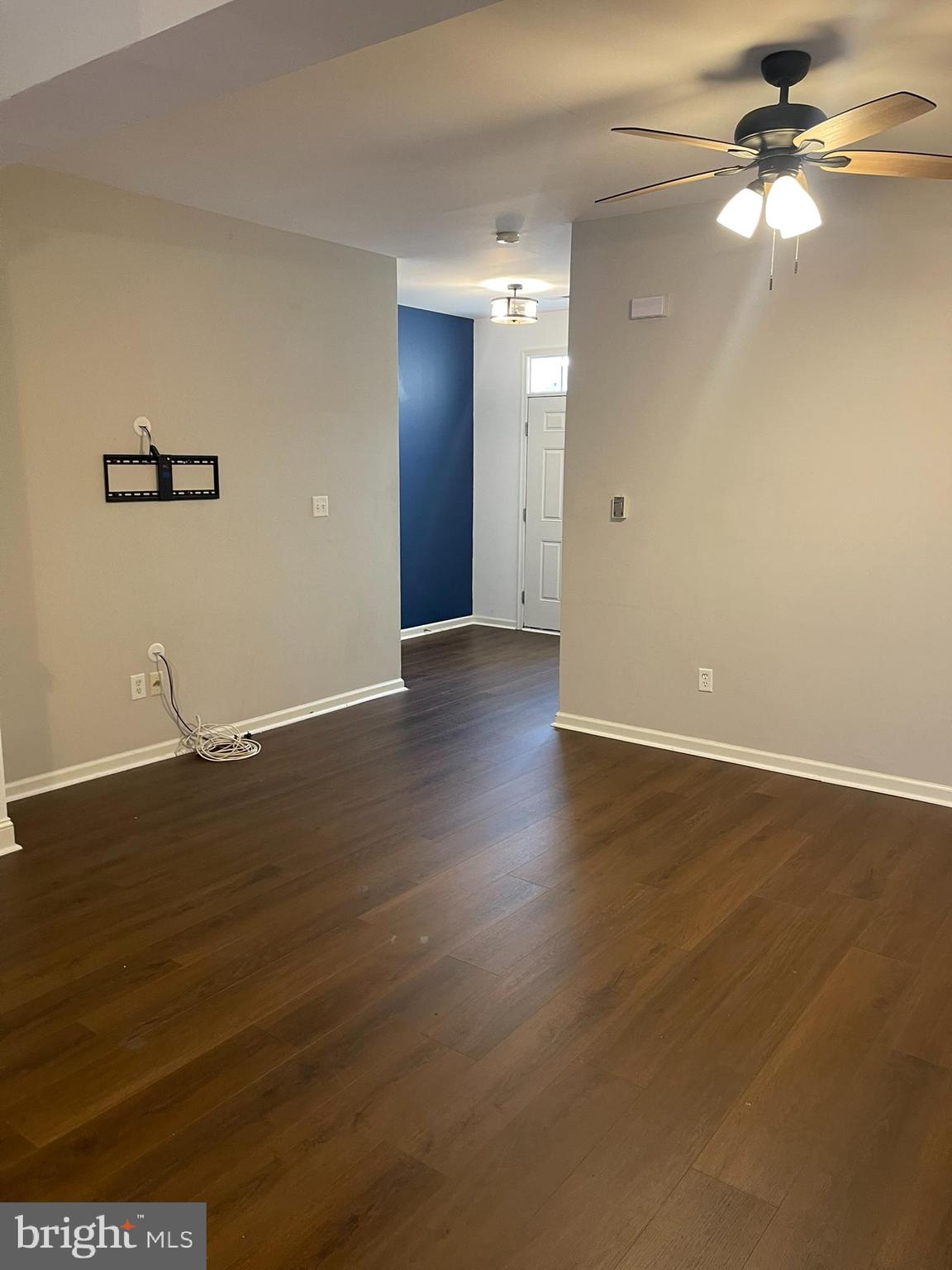 310 Norwalk Way Middletown, DE 19709 - Photo 7 of 37 an empty room with wooden floor and windows