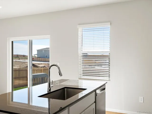 a bathroom with a sink and a window