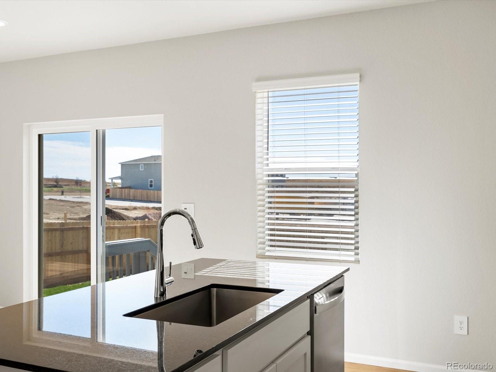 7305 West 27th St Road Greeley, CO 80634 - Photo 14 of 29 a bathroom with a sink and a window