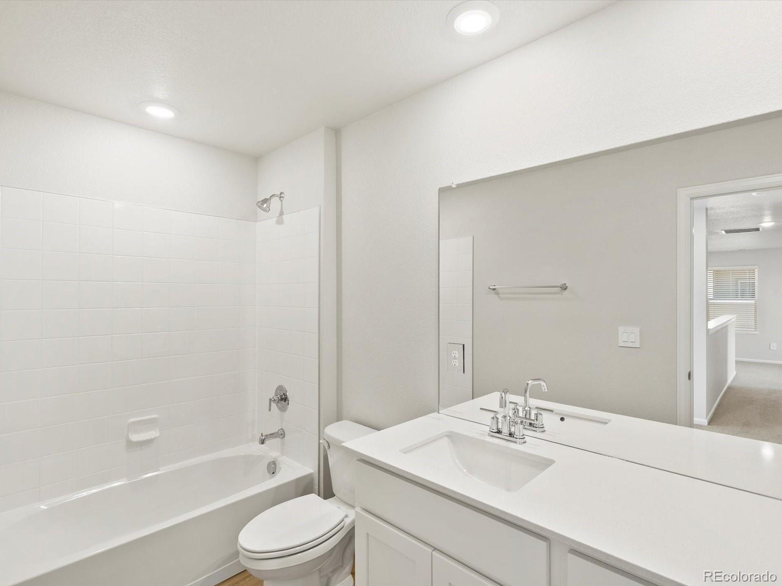 7305 West 27th St Road Greeley, CO 80634 - Photo 18 of 29 a bathroom with a sink a toilet and shower