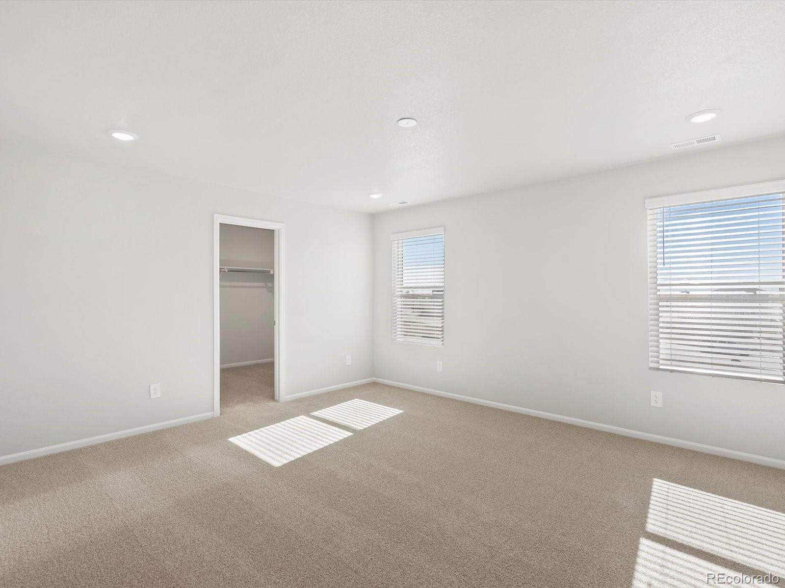 7305 West 27th St Road Greeley, CO 80634 - Photo 21 of 29 an empty room with windows