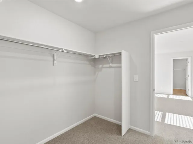 a view of an empty walk in closet