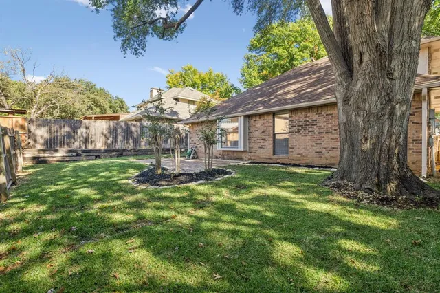 a backyard of a house with lots of green space