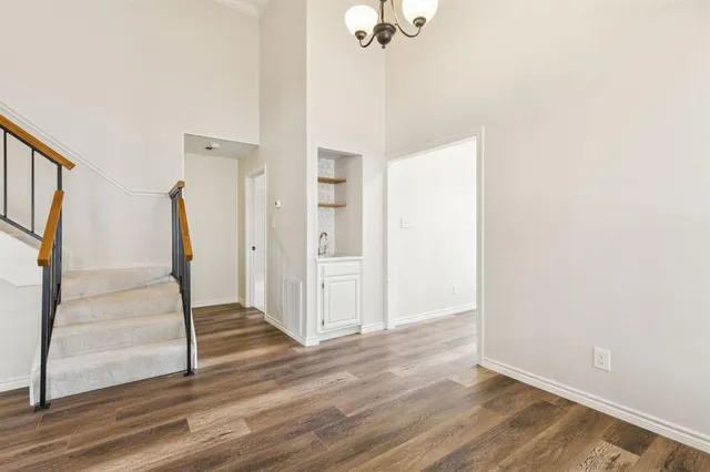 a view of entryway with wooden floor and stairs
