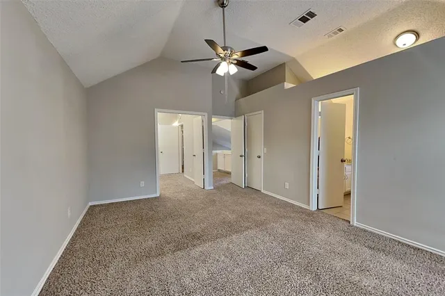a view of empty room with a ceiling fan