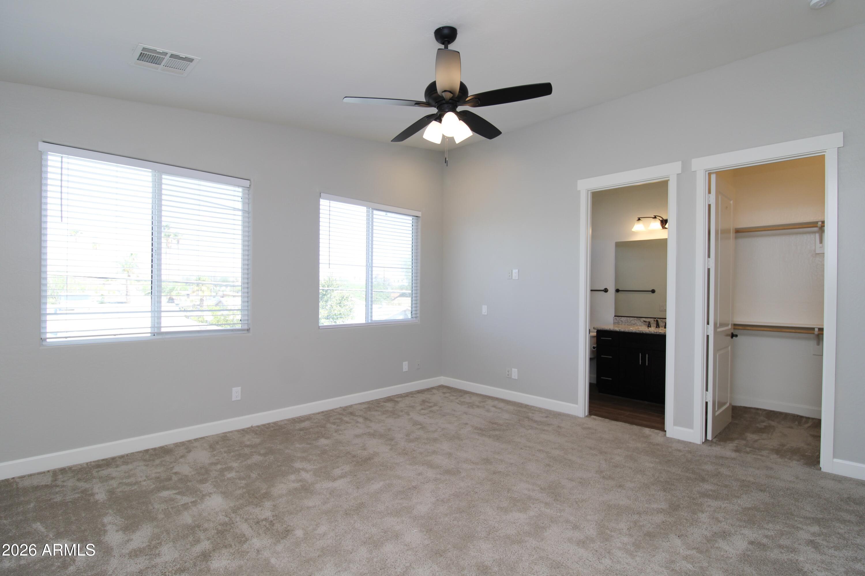 1024 East Curry Road, Unit 1A Tempe, AZ 85288 - Photo 14 of 23 a view of an empty room with a window