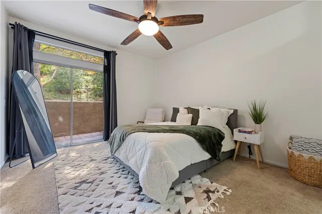 a bedroom with a bed and a couch