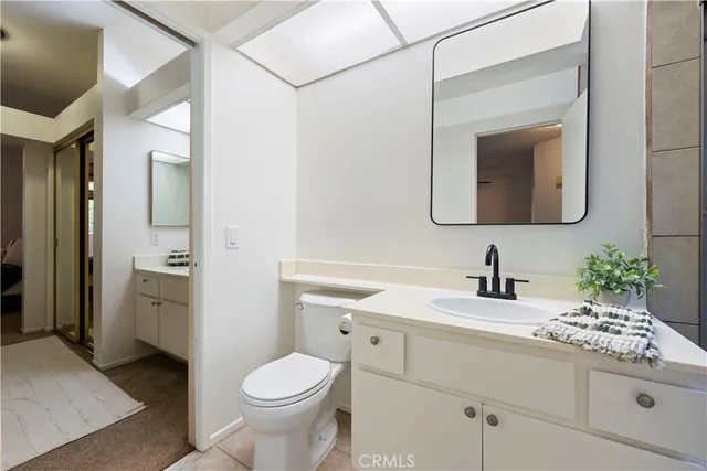 a view of bathroom with a refrigerator