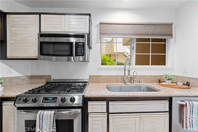 a view of a kitchen with washer and dryer