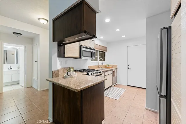 a bedroom with furniture and a large window