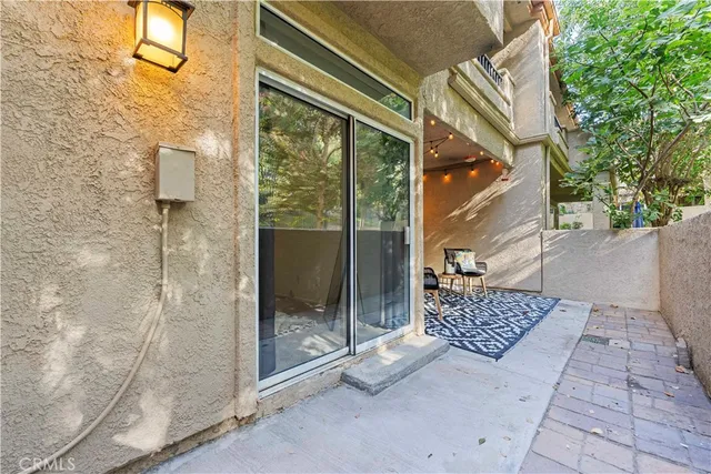 a view of a chairs and table in a patio