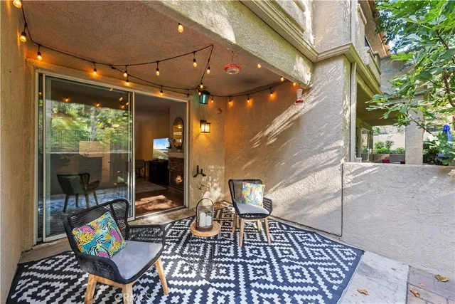 a view of a patio with a table and chairs