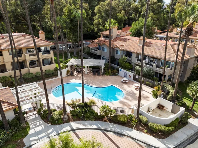 a aerial view of a house with pool