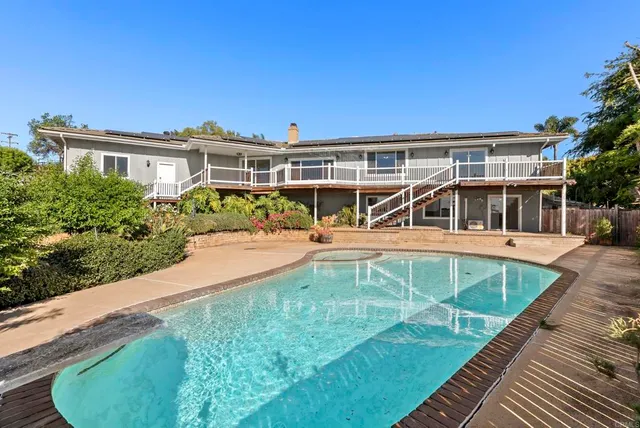 a view of a house with swimming pool