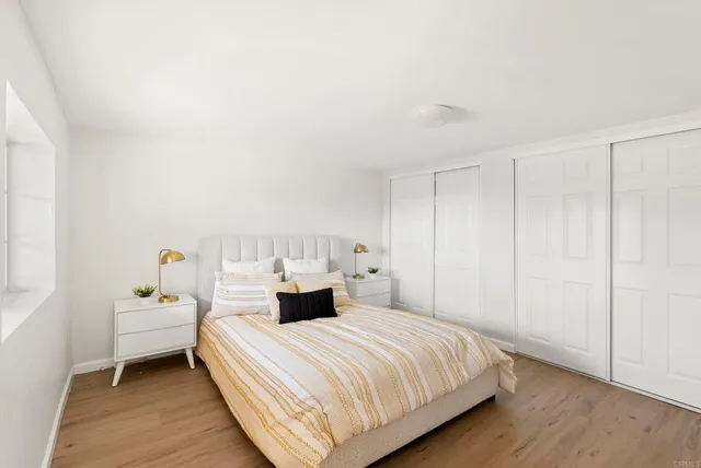 a bedroom with a bed and window