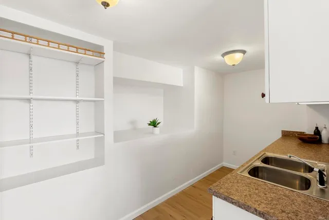 a view of a kitchen with a sink and dishwasher